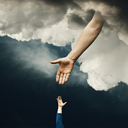 Hand reaches down from the clouds to a child's hand.